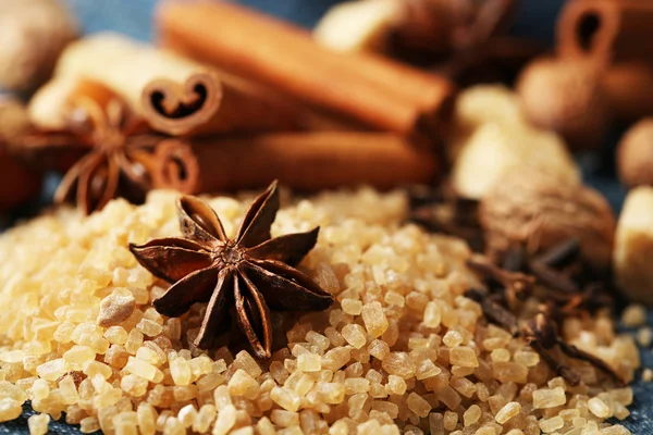 Christmas spices and baking ingredients on color napkin, on wooden background — Stock Photo, Image