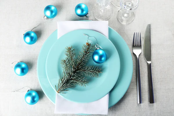 Stylish blue and white Christmas table setting on grey tablecloth background — Stock Photo, Image