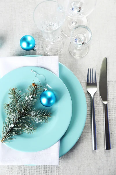 Stylish blue and white Christmas table setting on grey tablecloth background — Stock Photo, Image