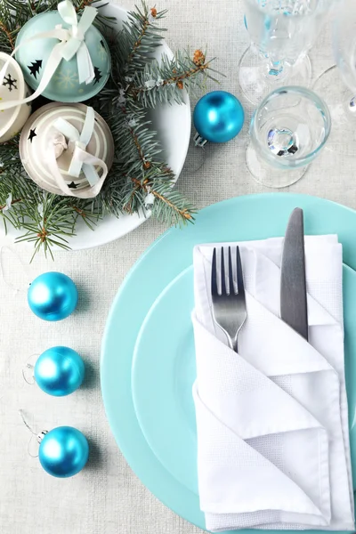 Stylish blue and white Christmas table setting on grey tablecloth background — Stock Photo, Image