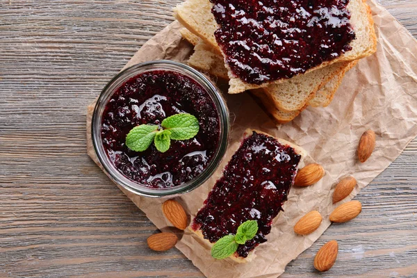 Delicious black currant jam on table close-up — Stock Photo, Image