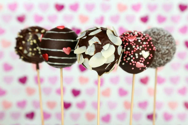 Tasty cake pops on color background — Stock Photo, Image