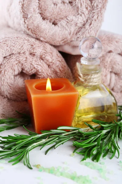 Branches of rosemary with massage oil — Stock Photo, Image