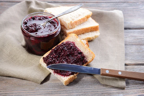 Delicious black currant jam on table close-up — Stock Photo, Image