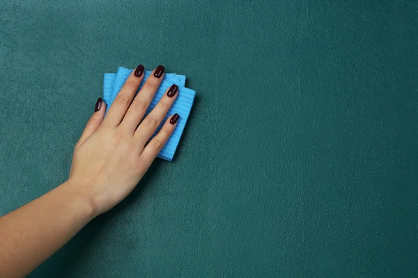 Female hand wiping blackboard close-up — Stock Photo, Image