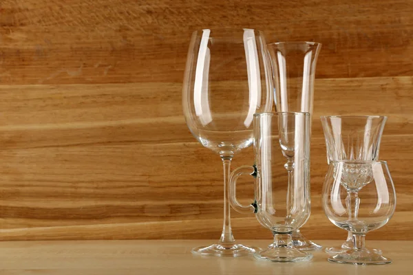 Empty goblets on wooden background — Stock Photo, Image