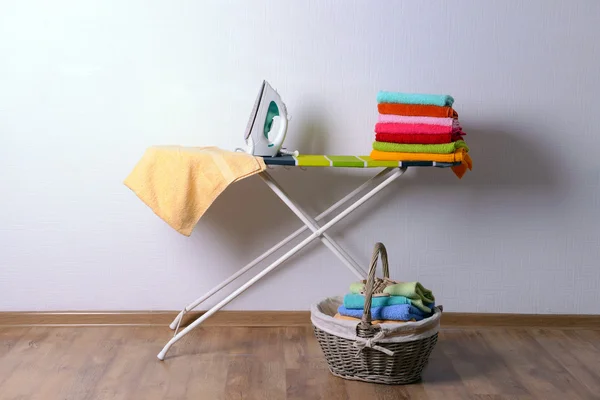 Ironing board with laundry — Stock Photo, Image