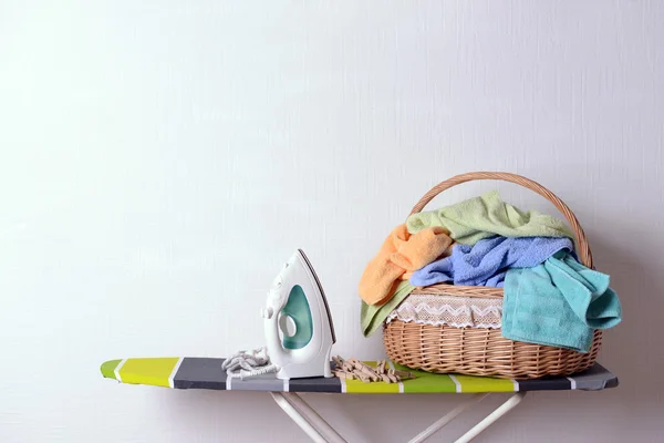 Ironing board with laundry — Stock Photo, Image