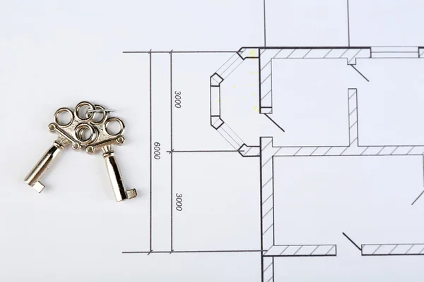 Key on house plan close-up — Stock Photo, Image