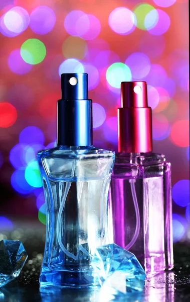 Women's perfume in beautiful bottles on festive shiny background — Stock Photo, Image