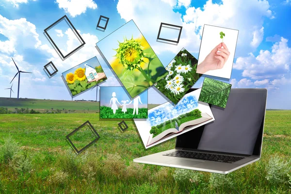 Laptop och bilder av natur på fältet och himmel bakgrund — Stockfoto