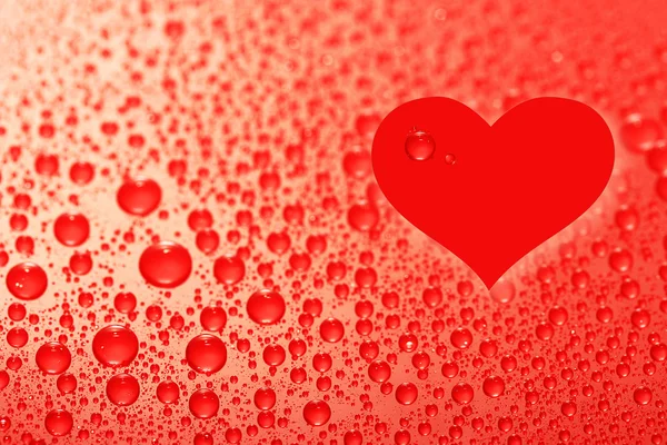 Water drops background with heart sign — Stock Photo, Image