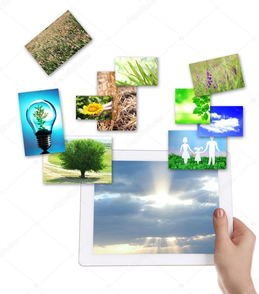 Tablet PC in hand and images of nature objects isolated on white