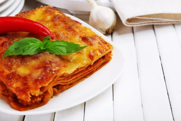 Portion of tasty lasagna on table — Stock Photo, Image