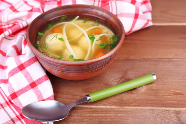 Soup with meatballs and noodles in bowl on wooden background — Stock Photo, Image