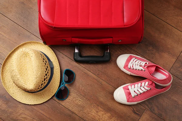 Suitcase and tourist stuff — Stock Photo, Image