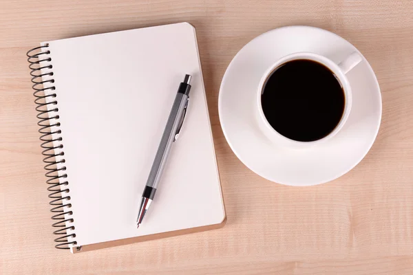 Cup of coffee with notebook — Stock Photo, Image