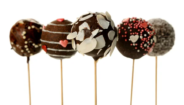 Tasty cake pops, isolated on white — Stock Photo, Image