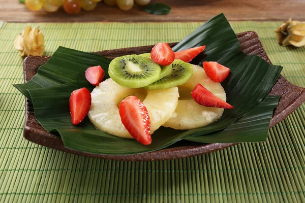 Fruit dessert on green leaf on table — Stock Photo, Image