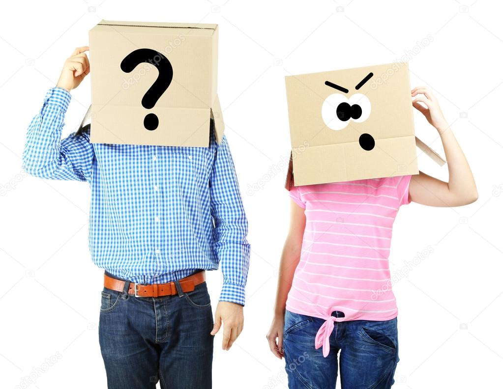 Couple with cardboard boxes on their heads isolated on white