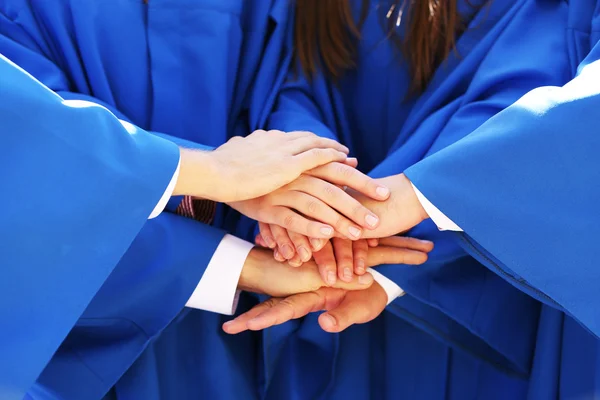 Graduate students hands close-up — Stock Photo, Image