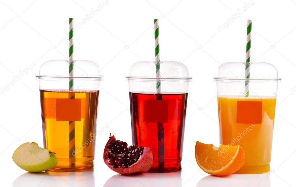 Fruit juices in fast food closed cup with tube and slices isolated on white