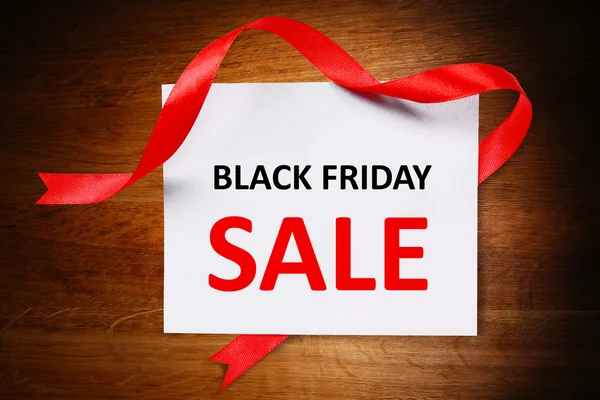 Card with Black Friday Sale text on wooden background — Stock Photo, Image