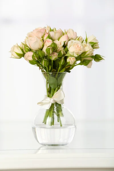 Beautiful bouquet of flowers in vase on window background — Stock Photo, Image