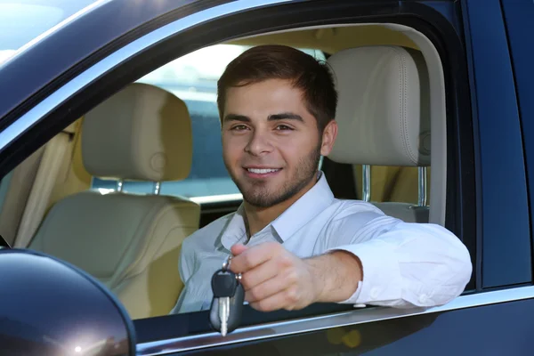 Young man in car — Stock Photo, Image