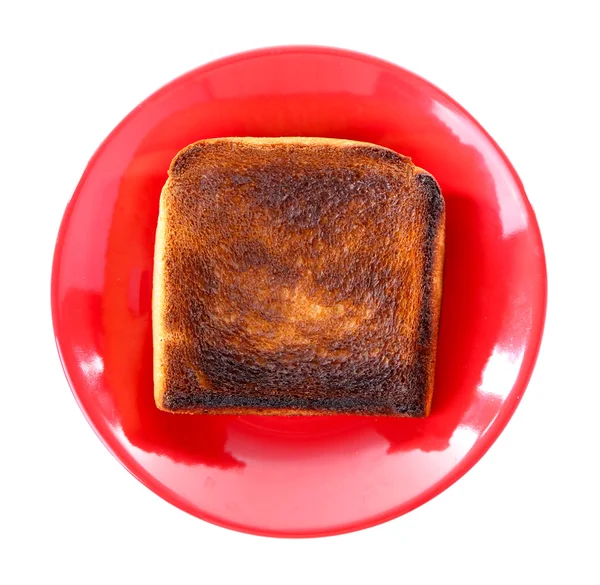 Burnt toast bread on plate, isolated on white background — Stock Photo, Image