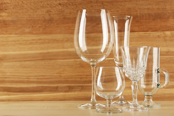 Empty goblets on wooden background — Stock Photo, Image