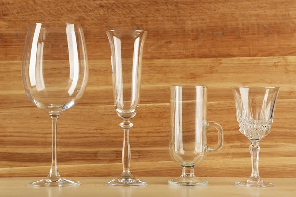 Empty goblets on wooden background — Stock Photo, Image