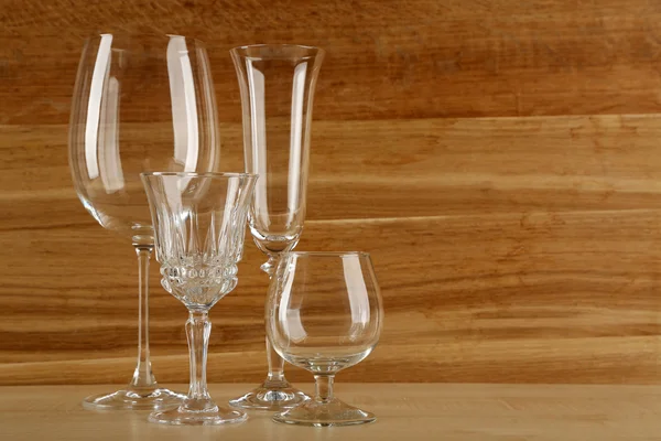 Empty goblets on wooden background — Stock Photo, Image
