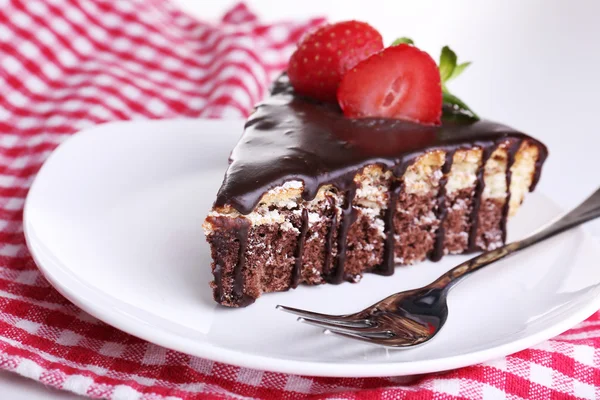 Chocolate cake on napkin, close-up — Stock Photo, Image