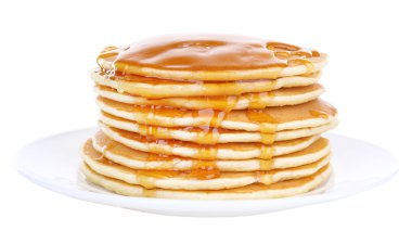 Stack of delicious pancakes with honey on plate isolated on white clipart