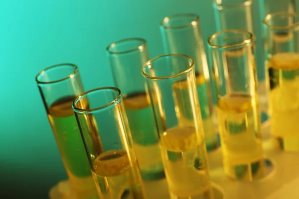 Colorless liquid in the test-tubes on the muted background — Stock Photo, Image