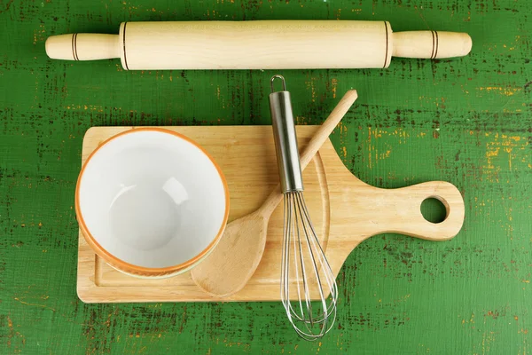 Kitchen utensils for baking on color wooden background — Stock Photo, Image