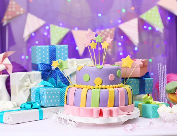 Delicious birthday cake on shiny purple background — Stock Photo, Image