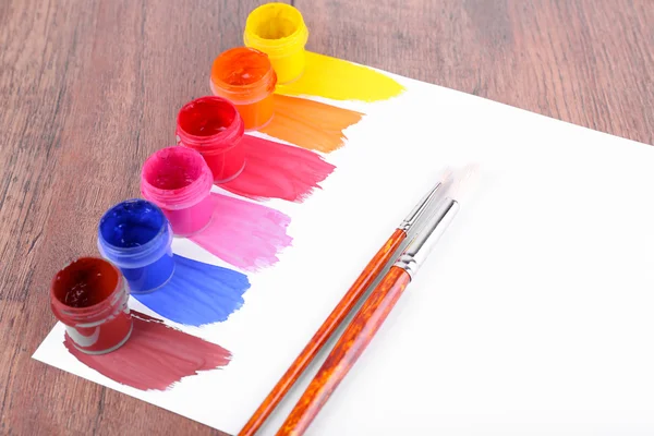 Paint strokes with brush and paint cans — Stock Photo, Image