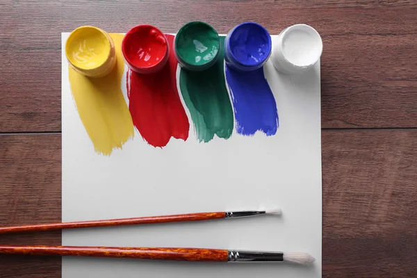 Paint strokes with brush and paint cans — Stock Photo, Image