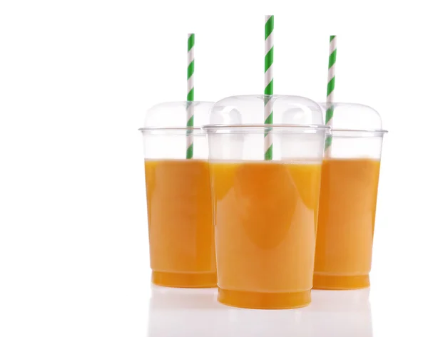 Orange juice in fast food closed cups with tubes isolated on white — Stock Photo, Image