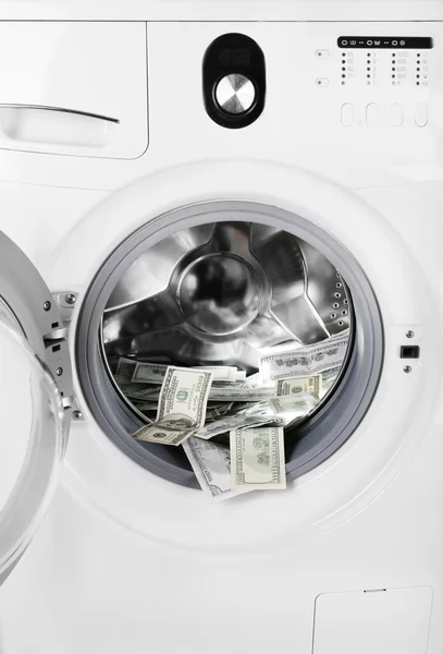 Гроші в пральній машині — стокове фото