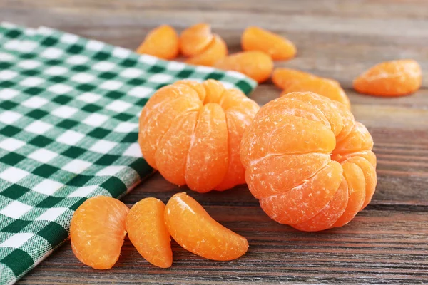 Tangerines on napkin on table — Stock Photo, Image