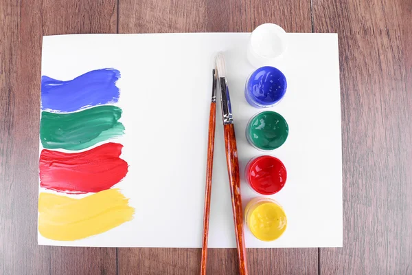 Paint strokes with brush and paint cans — Stock Photo, Image