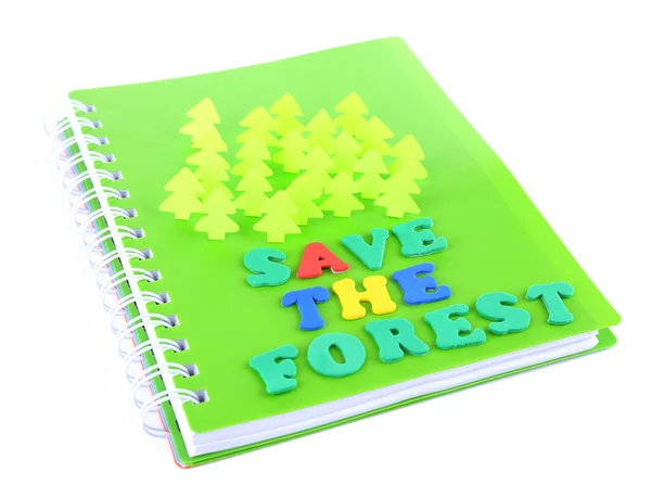 Concept of conservation forests of cut paper on notebook isolated on white — Stock Photo, Image