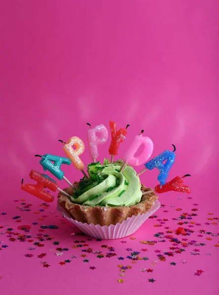 Cake with birthday candles on pink background — Stock Photo, Image