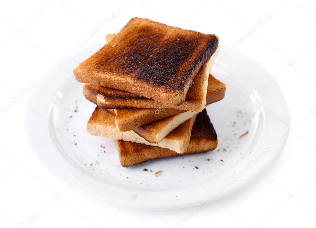 Burnt toast bread on plate, isolated on white background — Stock Photo