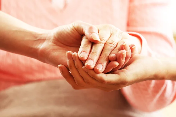 Old and young hands — Stock Photo, Image