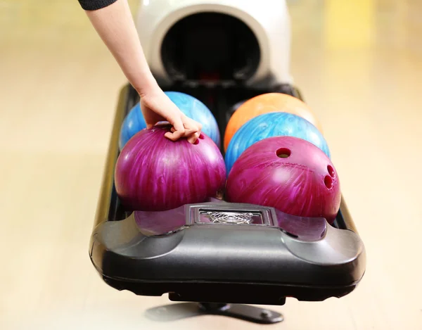 Colorful Bowling balls in ball return — Stock Photo, Image