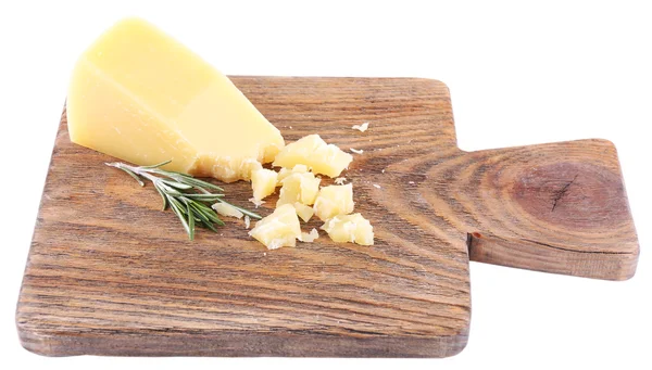 Crumbled Parmesan cheese with sprig of rosemary on cutting board isolated on white — Stock Photo, Image